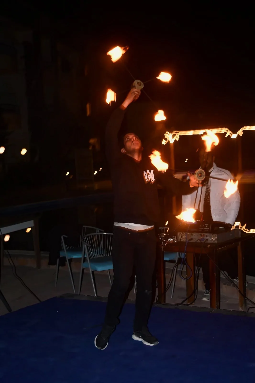 Fire show by the pool at night